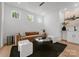 Modern living room with a brown sofa, wet bar and large artwork at 516 Stegall St, Charlotte, NC 28217