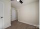 Simple bedroom with hardwood floors and an additional door at 1402 Springdale Park Dr, Lincolnton, NC 28092