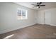 Sunny bedroom with hardwood floors and ceiling fan at 1402 Springdale Park Dr, Lincolnton, NC 28092