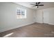 Well-lit bedroom with hardwood floors, ceiling fan and a window at 1402 Springdale Park Dr, Lincolnton, NC 28092