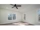 Spacious bedroom with hardwood floors, ceiling fan, and large windows at 1402 Springdale Park Dr, Lincolnton, NC 28092