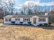 Newly renovated white brick ranch home with updated landscaping at 1402 Springdale Park Dr, Lincolnton, NC 28092