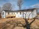 White brick house with a wooden deck and yard at 1402 Springdale Park Dr, Lincolnton, NC 28092