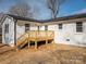 Rear view of charming house with deck and landscaping at 1402 Springdale Park Dr, Lincolnton, NC 28092