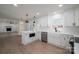 Modern kitchen with white shaker cabinets, quartz countertops, and stainless steel appliances at 1402 Springdale Park Dr, Lincolnton, NC 28092