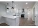 Modern kitchen with white shaker cabinets, quartz countertops, and stainless steel appliances at 1402 Springdale Park Dr, Lincolnton, NC 28092