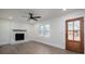 Bright living room featuring a fireplace, hardwood floors, and a ceiling fan at 1402 Springdale Park Dr, Lincolnton, NC 28092