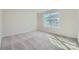 Light-filled bedroom featuring neutral carpeting and a large window at 1603 Croydon St, Indian Land, SC 29707