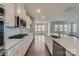 Contemporary kitchen featuring stainless appliances and a large island with a sink at 1603 Croydon St, Indian Land, SC 29707