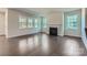 Bright living room with a fireplace, recessed lighting, and hardwood floors at 1603 Croydon St, Indian Land, SC 29707