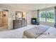 Spacious main bedroom with dresser, seating area, and large window at 1808 Otter Perch Ln, Fort Mill, SC 29715