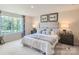 Main bedroom with king-size bed and plenty of natural light at 1808 Otter Perch Ln, Fort Mill, SC 29715