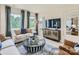 Living room with contemporary furniture, large windows and a view at 1808 Otter Perch Ln, Fort Mill, SC 29715