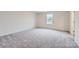 Well-lit bedroom with gray carpet and a window at 2464 Trollinger Dr, Catawba, NC 28609