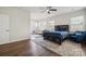 Main bedroom with blue bedding, hardwood floors, and access to a private patio at 4015 Havenport Cir, Tega Cay, SC 29708