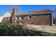 Brick home backyard featuring a patio and well-maintained lawn at 433 Pamela St, Gastonia, NC 28054