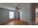 Well-lit bedroom with hardwood floors and ceiling fan at 433 Pamela St, Gastonia, NC 28054