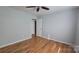 Hardwood floor bedroom with ceiling fan and closet at 433 Pamela St, Gastonia, NC 28054