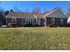 Charming single-story brick home with well-maintained front yard and mature landscaping at 433 Pamela St, Gastonia, NC 28054