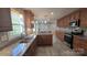 Updated kitchen featuring granite countertops, stainless steel appliances and wood cabinets at 433 Pamela St, Gastonia, NC 28054