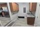 Convenient laundry room with granite countertops, and lots of cabinets for storage at 433 Pamela St, Gastonia, NC 28054