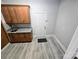 Laundry room with granite countertop and built-in cabinets at 433 Pamela St, Gastonia, NC 28054