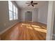 Bright living room with hardwood floors and ceiling fan at 433 Pamela St, Gastonia, NC 28054