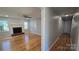 Inviting living room featuring a classic fireplace, hardwood floors, and neutral paint at 433 Pamela St, Gastonia, NC 28054