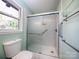 Updated bathroom with a large shower and marble tile at 5315 Ruth Dr, Charlotte, NC 28215