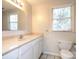 Clean bathroom with vanity, toilet and window at 5315 Ruth Dr, Charlotte, NC 28215