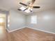 Bright bedroom with hardwood floors and ceiling fan at 5315 Ruth Dr, Charlotte, NC 28215