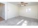 Carpeted bedroom with ceiling fan and window at 5315 Ruth Dr, Charlotte, NC 28215