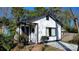White house with dark trim, landscaping, and a paved driveway at 5315 Ruth Dr, Charlotte, NC 28215