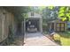 Spacious garage with vintage car, featuring an attached shed and ample storage space at 5315 Ruth Dr, Charlotte, NC 28215