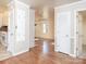 Hallway with hardwood floors and access to kitchen at 5315 Ruth Dr, Charlotte, NC 28215