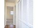 Hallway with hardwood floors and built-in storage at 5315 Ruth Dr, Charlotte, NC 28215
