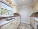Bright kitchen features double sink, new countertops, and updated cabinets at 5315 Ruth Dr, Charlotte, NC 28215