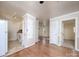 Kitchen with wood flooring and view into adjacent living room at 5315 Ruth Dr, Charlotte, NC 28215