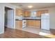 Kitchen with light wood cabinets, appliances, and tile floor at 5315 Ruth Dr, Charlotte, NC 28215