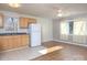 Open concept kitchen and living room with light wood cabinets and hardwood floors at 5315 Ruth Dr, Charlotte, NC 28215