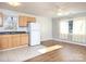 Open concept kitchen and living room with light wood cabinets and hardwood floors at 5315 Ruth Dr, Charlotte, NC 28215