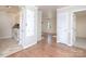 View of kitchen with appliances and adjacent living room with hardwood floors at 5315 Ruth Dr, Charlotte, NC 28215
