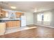 Open concept kitchen and living room with light wood cabinets and hardwood floors at 5315 Ruth Dr, Charlotte, NC 28215