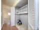 Well-lit laundry room with built-in shelving and plenty of storage at 5315 Ruth Dr, Charlotte, NC 28215