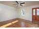 Living room with hardwood floors and a window at 5315 Ruth Dr, Charlotte, NC 28215
