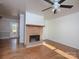 Living room with hardwood floors and brick fireplace at 5315 Ruth Dr, Charlotte, NC 28215