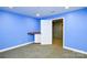 Finished basement room with blue walls, carpeting, and built-in cabinetry at 5839 Painted Fern Ct, Charlotte, NC 28269