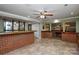 Brick bar in finished basement with tile floor at 5839 Painted Fern Ct, Charlotte, NC 28269