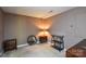 Small bedroom with two nightstands and a small mirror at 5839 Painted Fern Ct, Charlotte, NC 28269