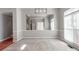 Spacious dining area with large window, neutral walls, and hardwood floors at 5839 Painted Fern Ct, Charlotte, NC 28269